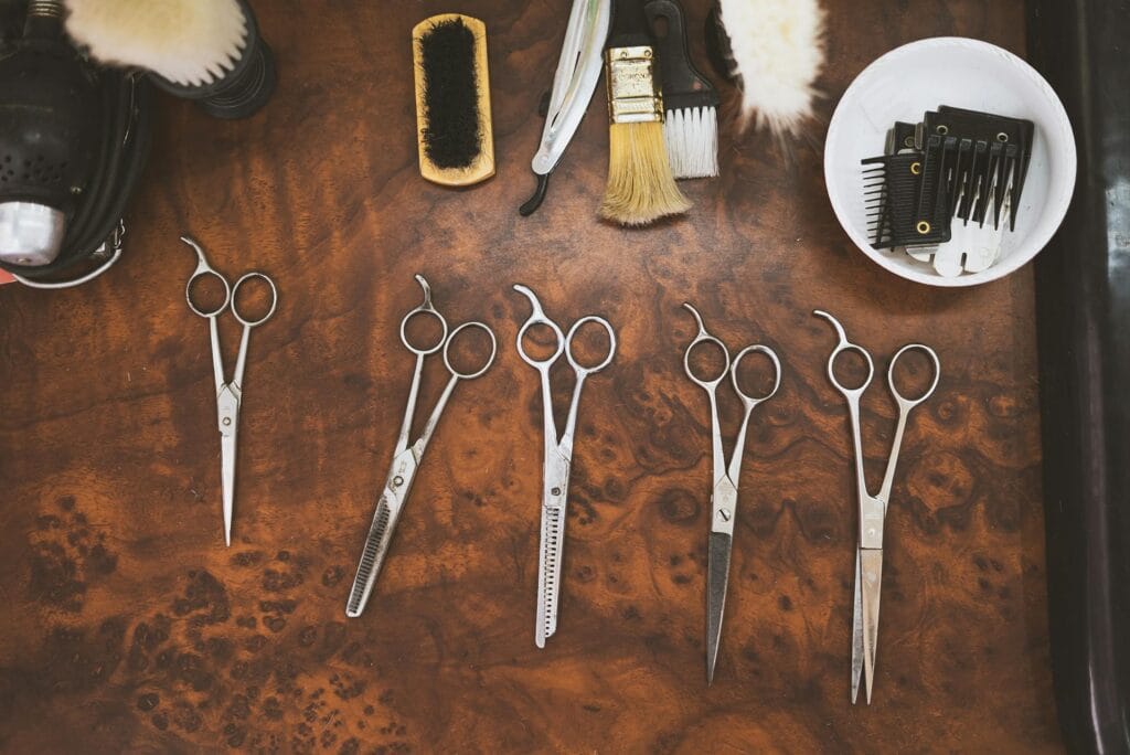 a group of scissors and brushes on a table