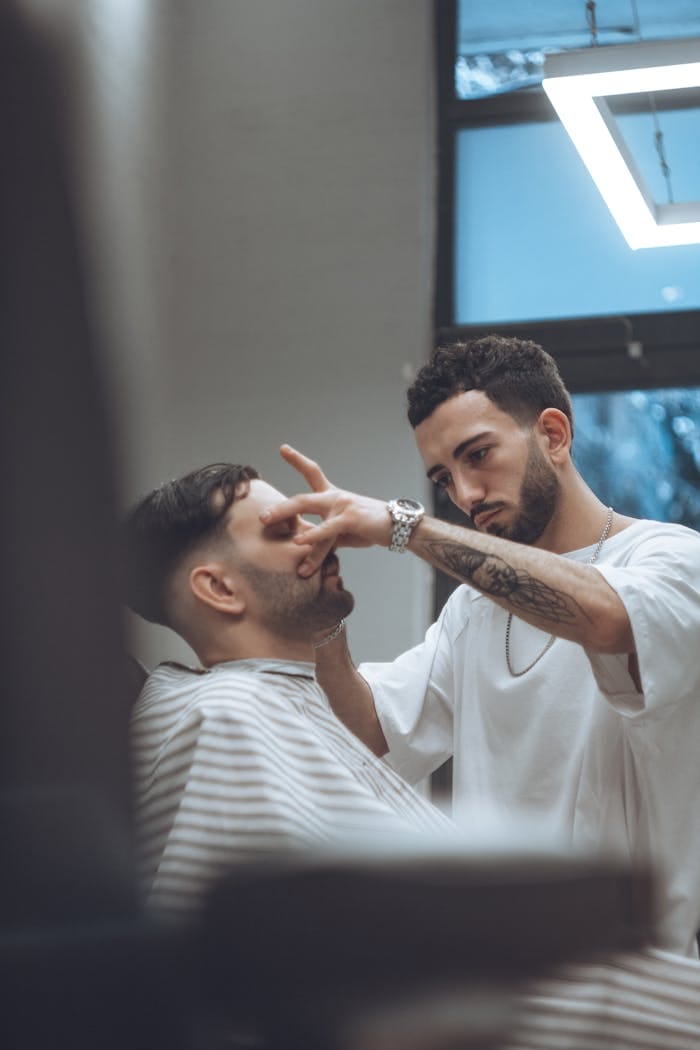 Barber School Near Me: How to Choose the Best Path to Becoming a Professional Barber 4 barber and younger man