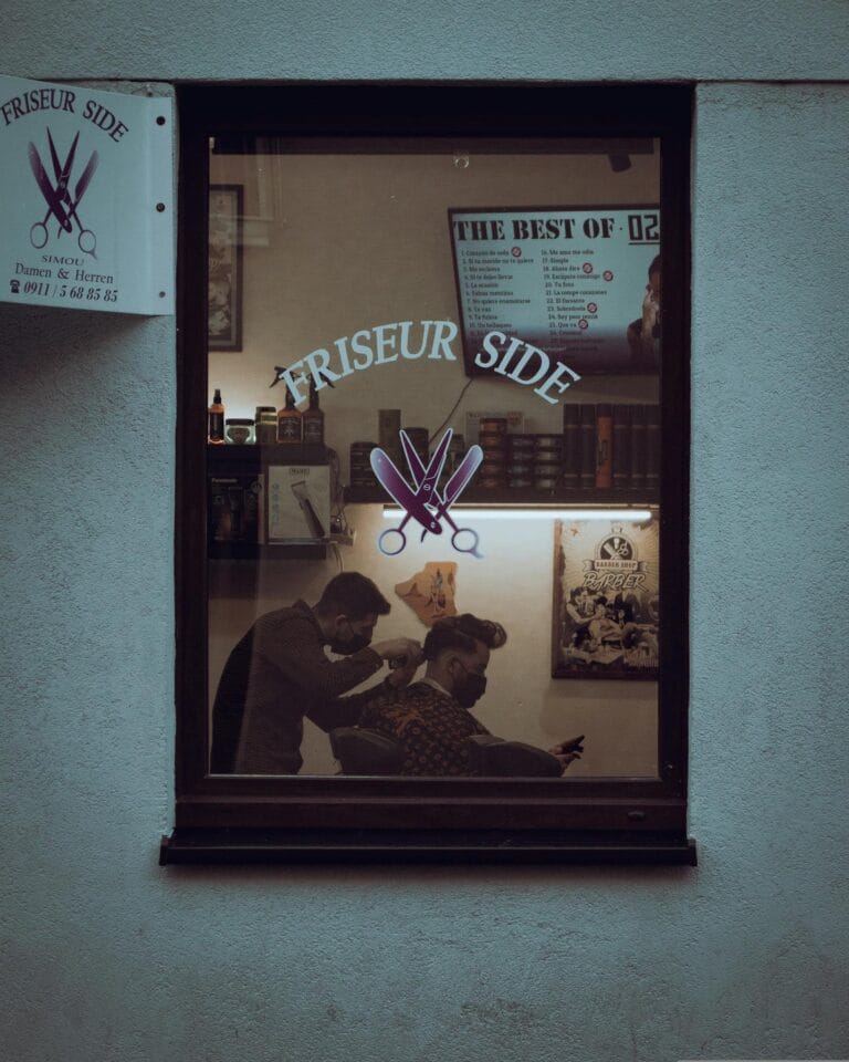 Finding the Cheapest Barbershop Near Me: A Comprehensive Guide to Affordable Grooming 11 Barber Giving a Hair through a Window