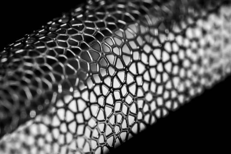 Best Clippers for Bald Heads in 2026: Shave It All Off 6 Close up macro of a foil shaver cutting mesh